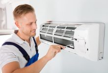 man doing air conditioning service