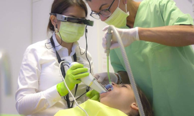 doctors operating on a patient wearing AR headset